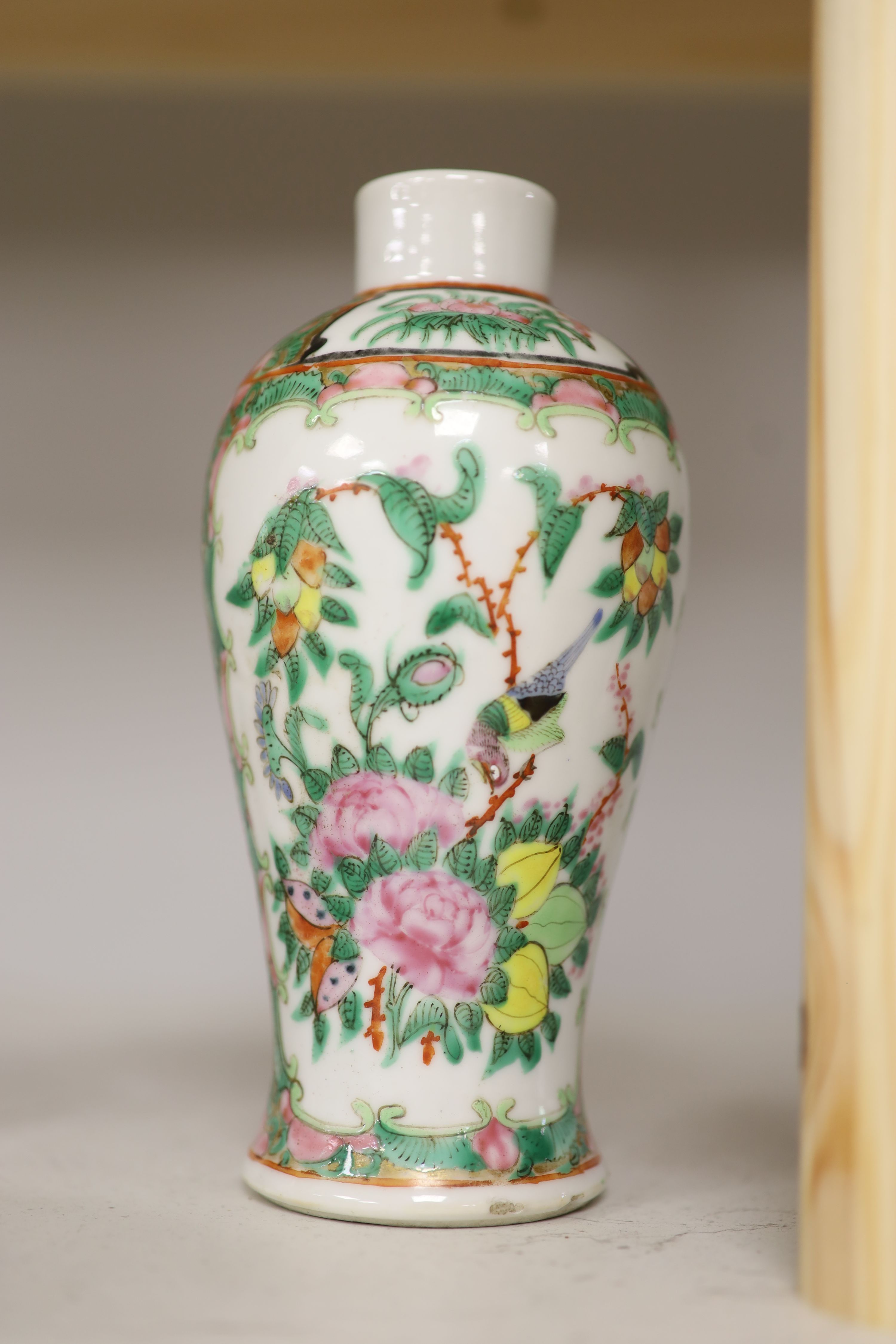A Chinese famille rose box and cover, two vases, a sugar bowl and cover and a saucer, late 19th/early 20th century, tallest 19cm